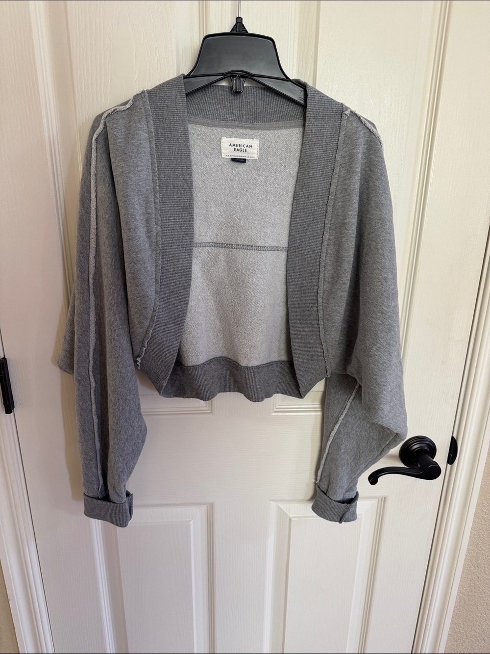 American Eagle shrug sweater. Grey color size XS. Good condition!